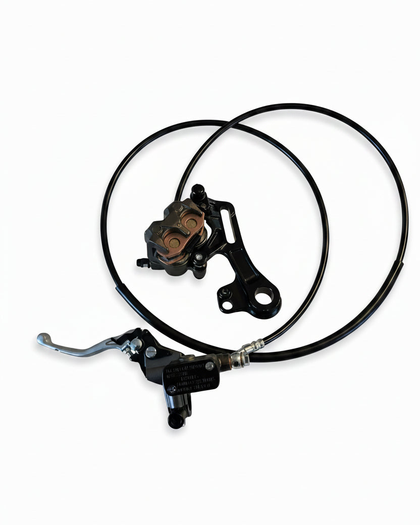 Surron Ultra Bee rear brake replacement overhead — caliper, master cylinder, and brake line