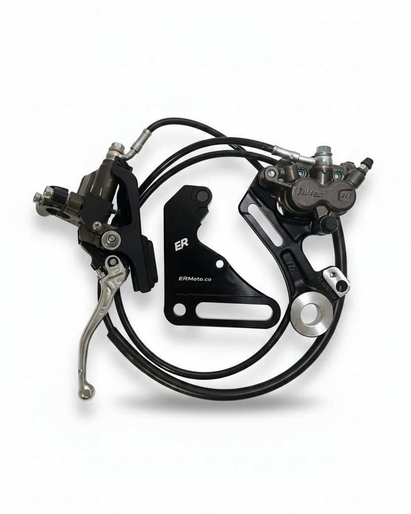 ER Moto OEM Surron Brand rear brake kit for Tuttio/Yozma — master cylinder, caliper, ER bracket, and pre-bled brake line laid out flat