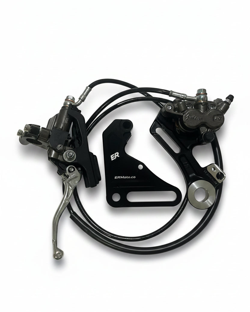ER Moto OEM Surron Brand rear brake kit for Tuttio/Yozma — master cylinder, caliper, ER bracket, and pre-bled brake line laid out flat