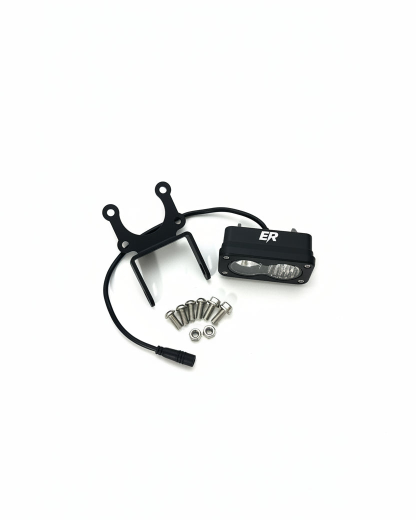 ER Moto Baja LED light kit contents — light, mounting bracket, wiring harness, bolts, and lock nuts