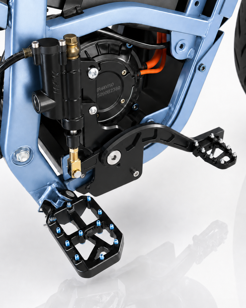 Installed shot: master cylinder, footbrake lever, grippy footpeg, dual caliper mount on blue Yozma frame