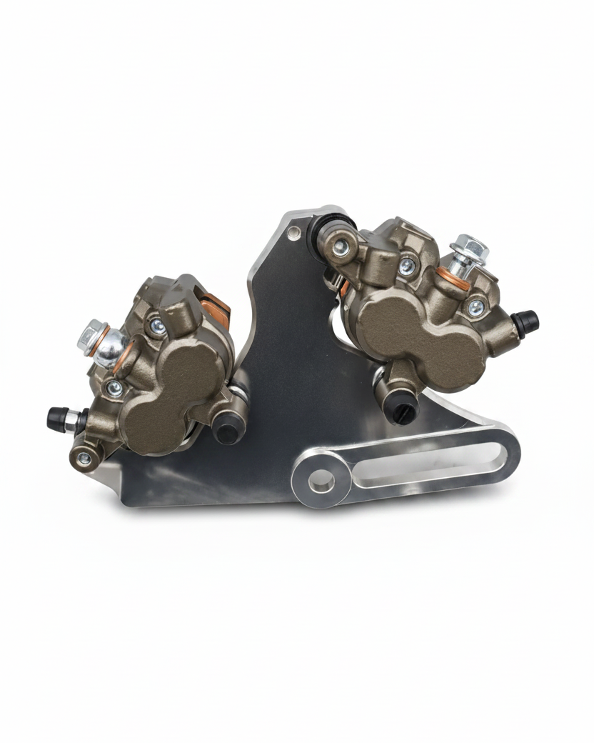 Dual caliper mount close-up: two calipers on machined aluminum bracket